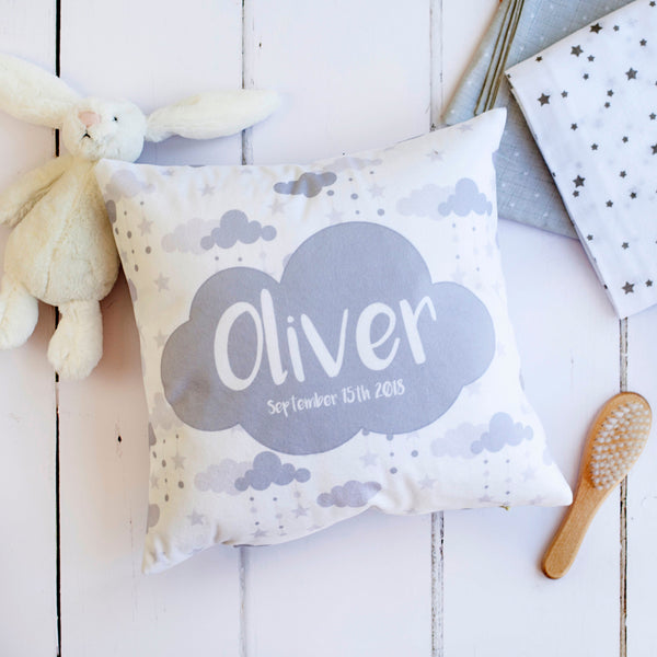 a square cushion with grey and white detailing.