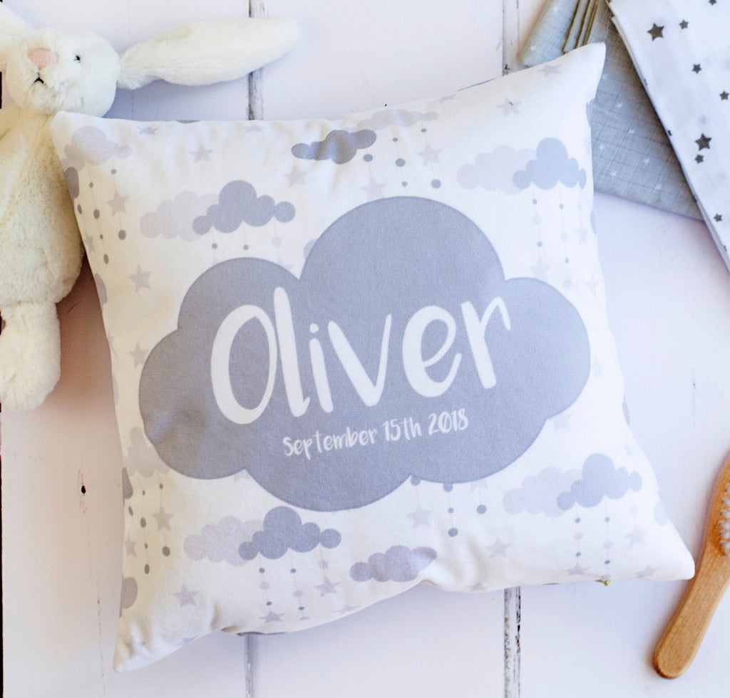 a square cushion with grey and white detailing.