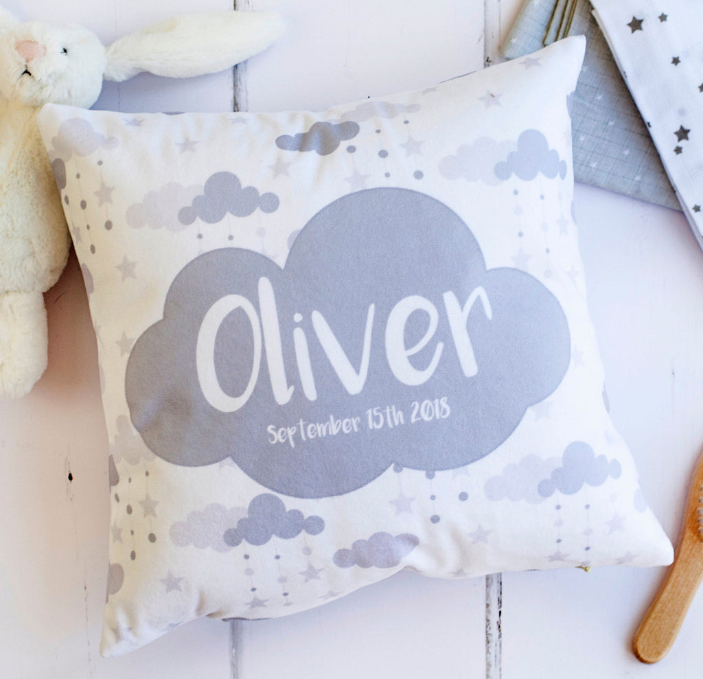 a square cushion with grey and white detailing.